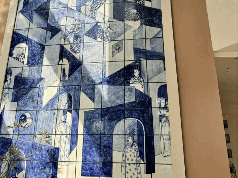 Blue and White Ceramic Mural with Geometric Architectural and Human Motifs